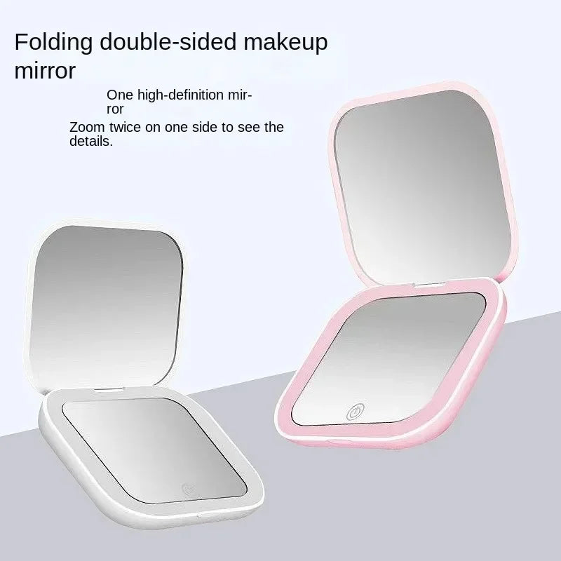 Portable Hand Held Pocket Makeup Mirror 2X magnifying with LED light capabilities.