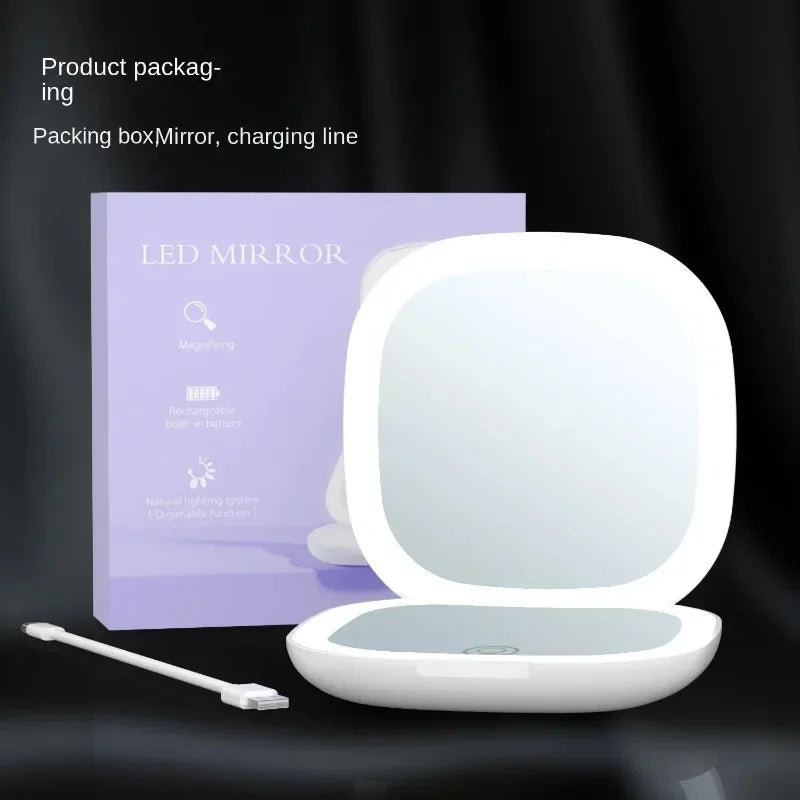 Portable Hand Held Pocket Makeup Mirror 2X magnifying with LED light capabilities.